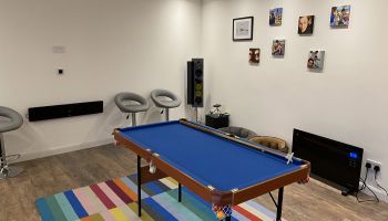 Games room with mini pool table home cinema and bar